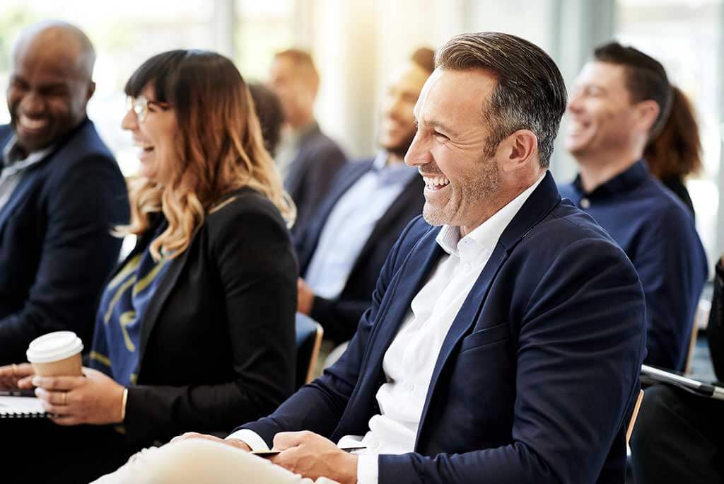 Man with hearing loss at a work event.